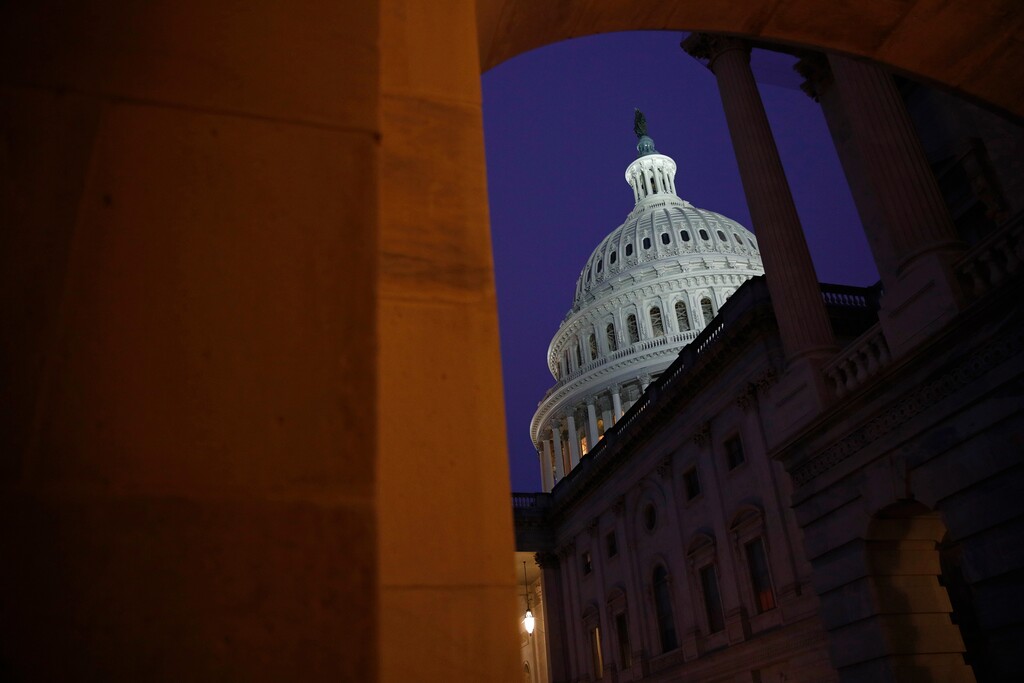 (Patrick Semansky | AP) Light shines on the U.S. Capitol dome before a House Judiciary Committee markup of the articles of impeachment against President Donald Trump, Friday, Dec. 13, 2019, on Capitol Hill in Washington.