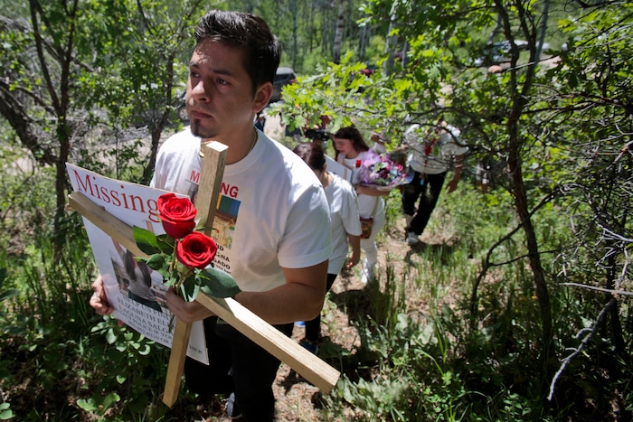Julio Cesar Laguna-Salgado walks up to the site, Friday, June 15, 2018, in Hobble Creek Canyon near Provo, Utah,  where his sister Elizabeth Elena Laguna-Salgado was found. The remains of the 26-year-old Mexican woman were discovered by a passer-by looking for a camping spot last month. She had been missing since April 16, 2015, when she was last seen walking home from her English language class. (Evan Cobb/The Daily Herald via AP)