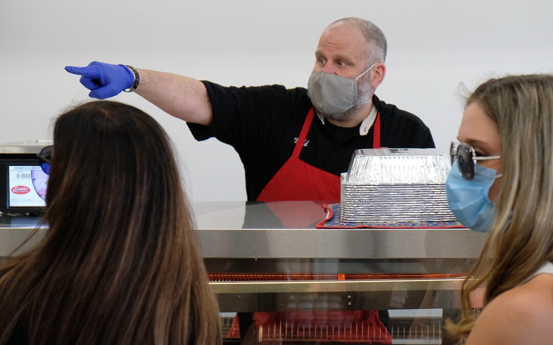 (Francisco Kjolseth  |  The Salt Lake Tribune) Todd Smith directs customers to meats available at Snider Brothers Meats in Cottonwood Heights on Tuesday, May 5, 2020.
