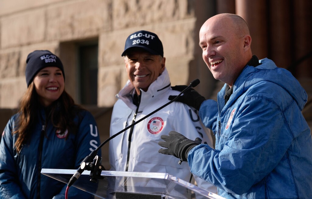 (Francisco Kjolseth | The Salt Lake Tribune) Salt Lake City Mayor Erin Mendenhall, Fraser Bullock, president and CEO of the Salt Lake City-Utah Committee for the Games and Utah Gov. Spencer Cox celebrate at City Hall on Wednesday, Nov. 29, 2023, following the announcement by the International Olympic Committee of Salt Lake as a "preferred host" of the 2034 Olympic Games following an IOC live broadcast from Paris.