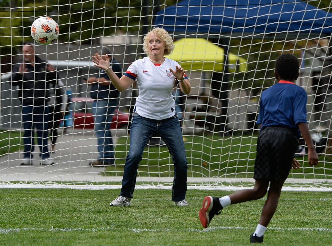 (Francisco Kjolseth  |  The Salt Lake Tribune)  Mayor Jackie Biskupski takes a turn as goalkeeper against her son Archie, 9, on the new multi-use field at Pioneer Park on Tuesday, Sept. 10, 2019. Salt Lake CityÕs Parks and Public Lands Division invited the public to attend a jubilee in celebration of the recently completed improvements at park, including enhanced lighting, a new walking path and trees and increased recreation and event programming for visitors and residents.
