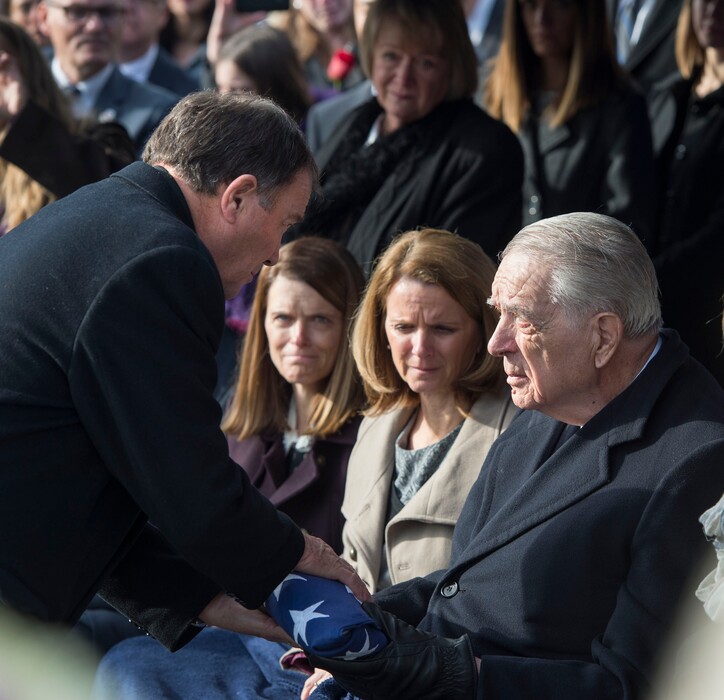 Steve Griffin  |  The Salt Lake TribuneGov. Gary Herbert, left, presents Myron Walker with the American Flag that was draped over the casket of his wife and former Gov. Olene Walker during graveside services Friday, December 4, 2015.