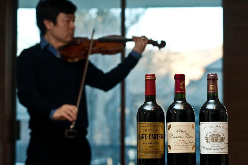(Chris Detrick | Tribune file photo) Utah Symphony assistant concertmaster David Park poses for a portrait with bottles of wine he was given in France.