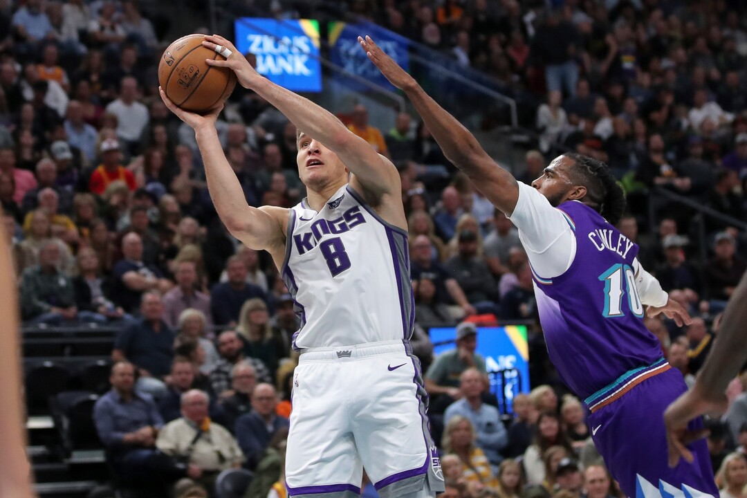 Sacramento Kings guard Bogdan Bogdanovic (8) shoots past Utah Jazz guard Mike Conley (10) during the second quarter of an NBA basketball game, Saturday, Oct. 26, 2019, in Salt Lake City. (AP Photo/Chris Nicoll)