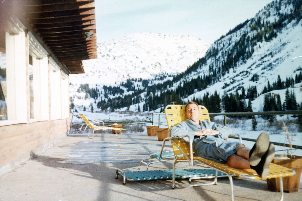 (Family photo via Todd Collins) John Cahill turned 100 on Thursday. He bought the Peruvian Lodge in Alta in 1970 and is seen lounging on its deck in the 1960s. He said many people told him the construction of nearby Snowbird would put Alta Ski Area out of business.
