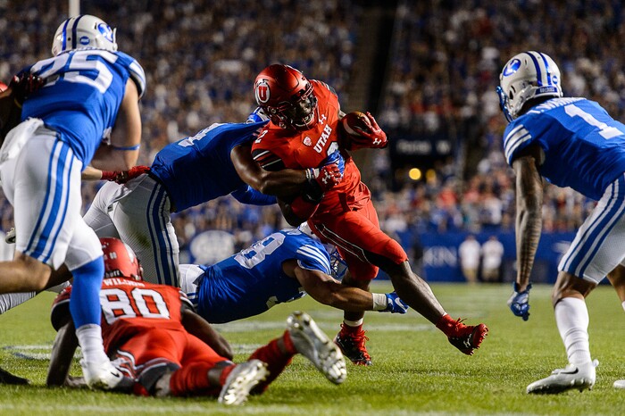 (Trent Nelson | The Salt Lake Tribune)  Utah Utes running back Zack Moss (2) runs the ball as BYU hosts Utah, NCAA football in Provo, Saturday September 9, 2017.