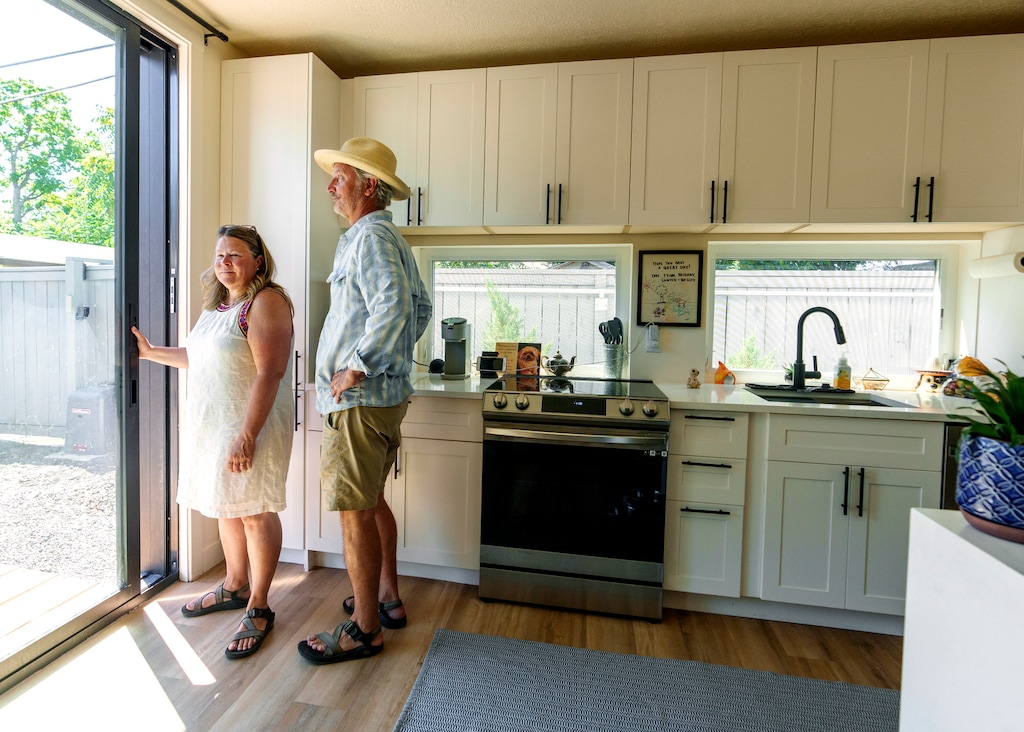 (Leah Hogsten | The Salt Lake Tribune)  Carolyn and Brett Matesen, on Aug. 4, 2023, stand inside the modular accessory dwelling unit (ADU) they built behind their home in the Ballpark neighborhood. They are renting the home to a friend.