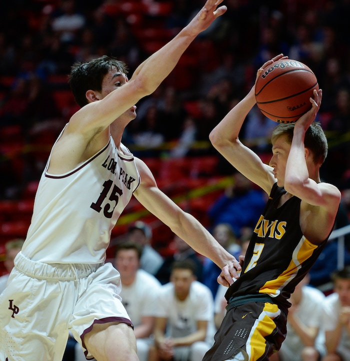 (Francisco Kjolseth  |  The Salt Lake Tribune)  Davis vs Lone Peak, 6A State high school basketball tournament at the Huntsman Center in Salt Lake City, Thursday March 1, 2018. Jaxon Pollard (15) puts the pressure on Trevan Leonhardt (2). 