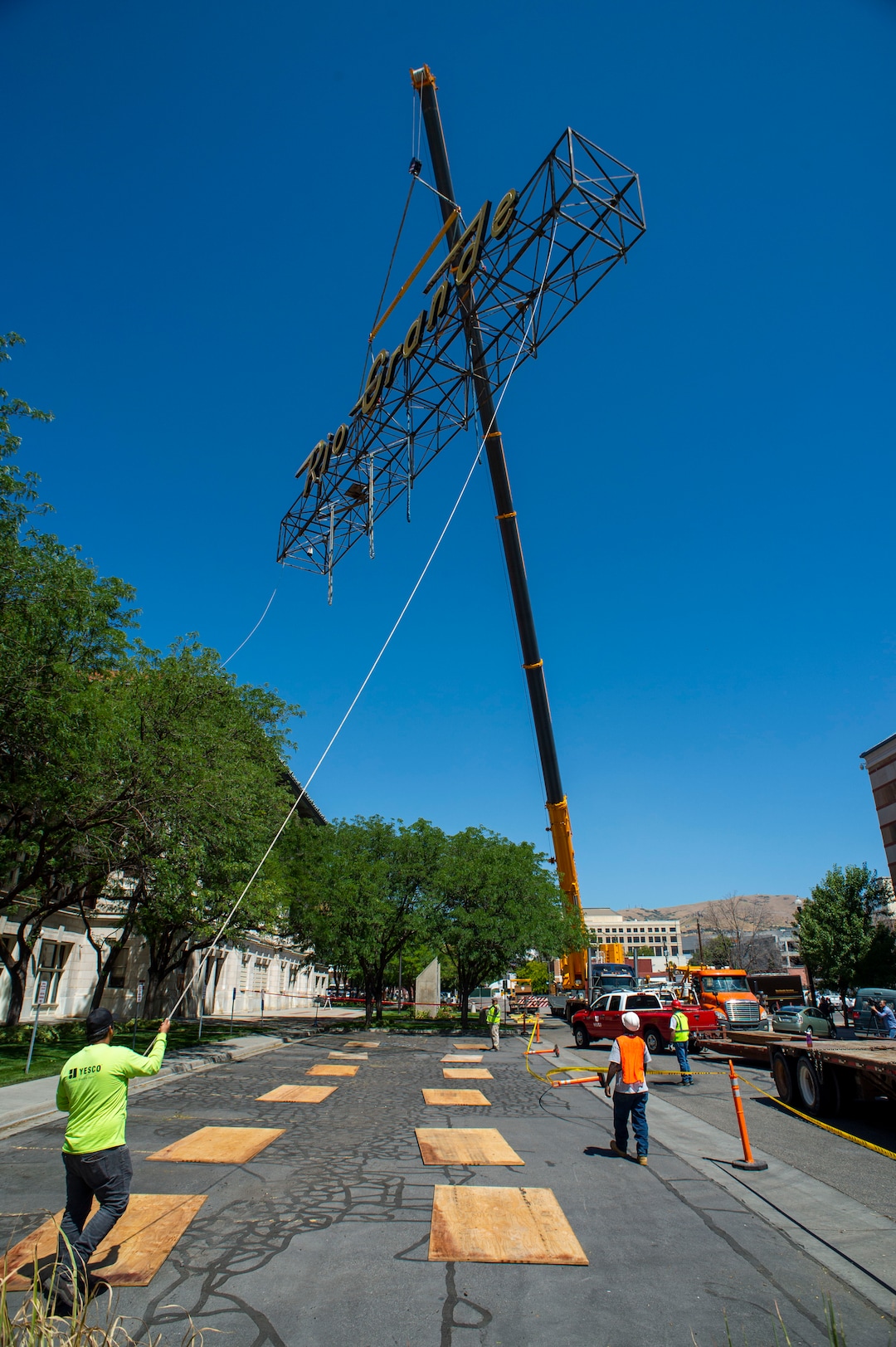 (Rick Egan  |  The Salt Lake Tribune)     The  neon Rio Grande sign that has shined from the rooftop of the Rio Grande Depot for more than 50 years is removed from the building, Monday, Aug. 12, 2019.