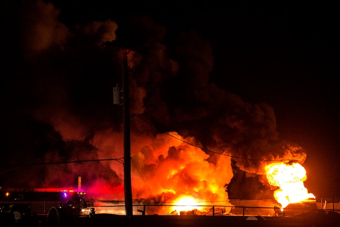 (Chris Detrick  |  The Salt Lake Tribune)  Firefighters attempt to put out a burning semitrailer that was hauling thousands of gallons of fuel on Interstate-15 in Midvale Thursday, January 18, 2018.   Lt. Todd Royce of the Utah Highway Patrol said the truck was southbound on the interstate at 7500 South at 7:20 p.m. when a tire caught fire, sending flames toward the tanks.