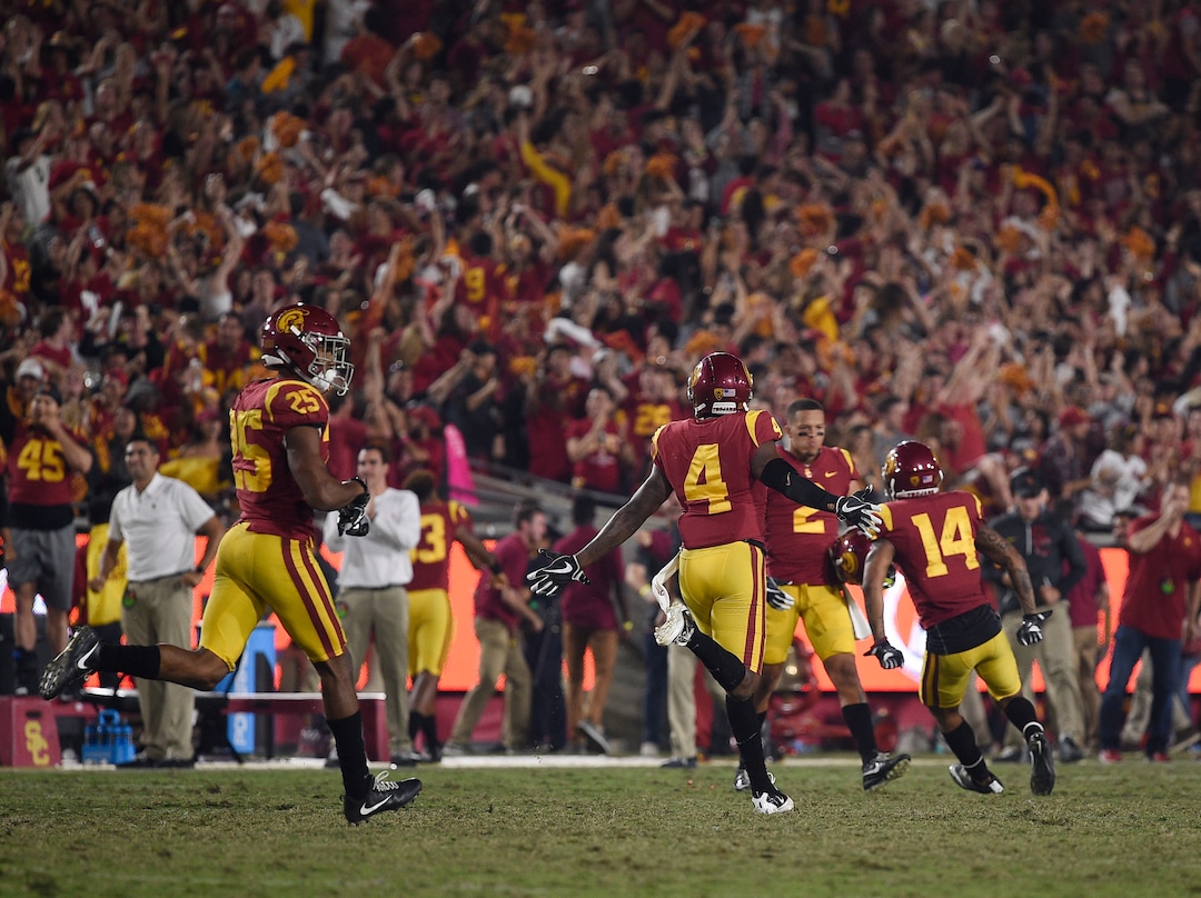 Southern California celebrates after stopping a 2-point conversion attempt during the second half of an NCAA college football game against Utah in Los Angeles, Saturday, Oct. 14, 2017. USC won 28-27. (AP Photo/Kelvin Kuo)