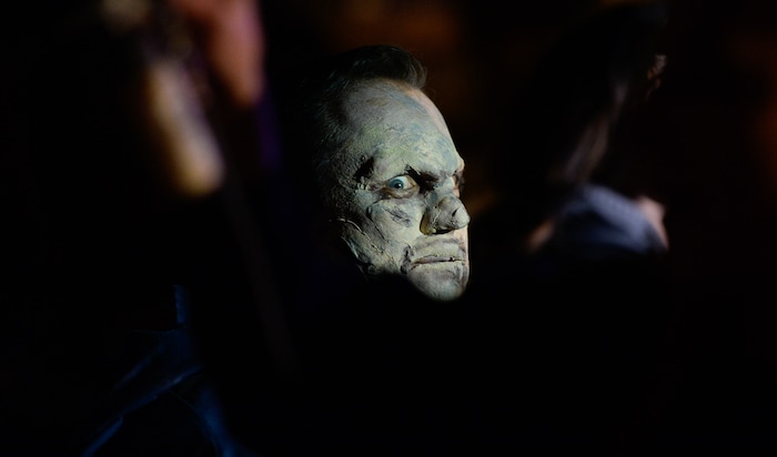 (Francisco Kjolseth  |  The Salt Lake Tribune)  Utah House Speaker Greg Hughes falls prey to the zombie apocalypse with the help of makeup artist Becky Manuel at the Fear Factory on Thursday, Oct. 12, 2017, for a special event to raise awareness of the Utah Food Bank and kick start donations. 