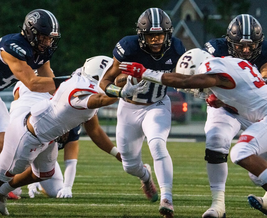 (Rick Egan | The Salt Lake Tribune) Tre Kofe (20) runs the ball for the Chargers, in prep football action between Corner Canyon Chargers and the East Leopards, on Saturday, Aug. 21, 2021.