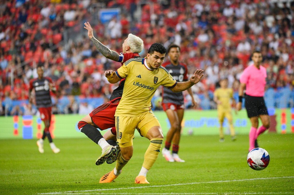 Real Salt Lake defender Brayan Vera, front, and Toronto FC forward Federico Bernardeschi collide during the second half of an MLS soccer match Saturday, July 1, 2023, in Toronto. (Chris Katsarov/The Canadian Press via AP)