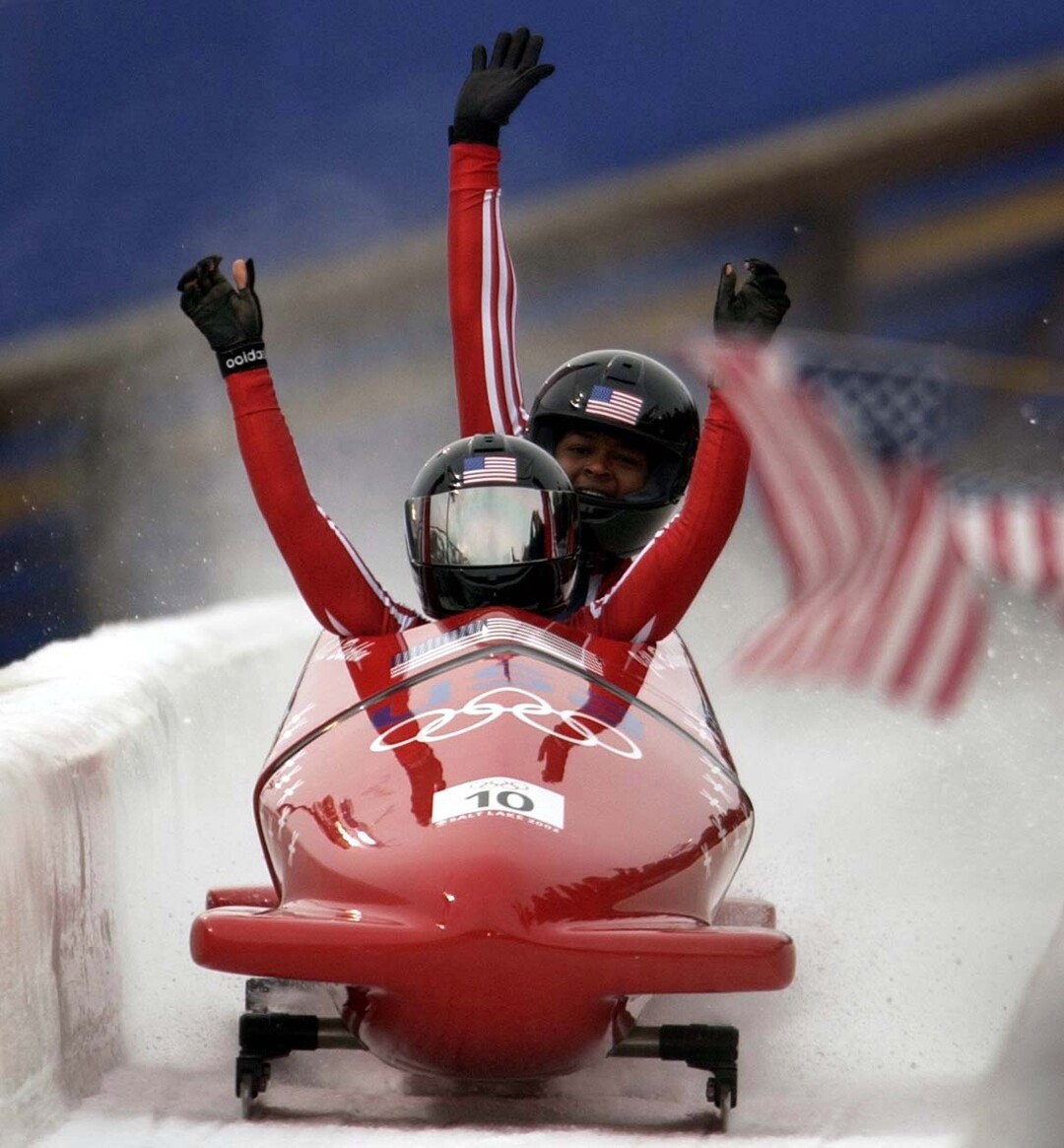 (Trent Nelson  |  Tribune file photo)  USA gold medalists Jill Bakken (front) and Vonetta Flowers celebrate their track record first run during the 2002 Olympic Winter Games at the Utah Olympic Park in Park City.