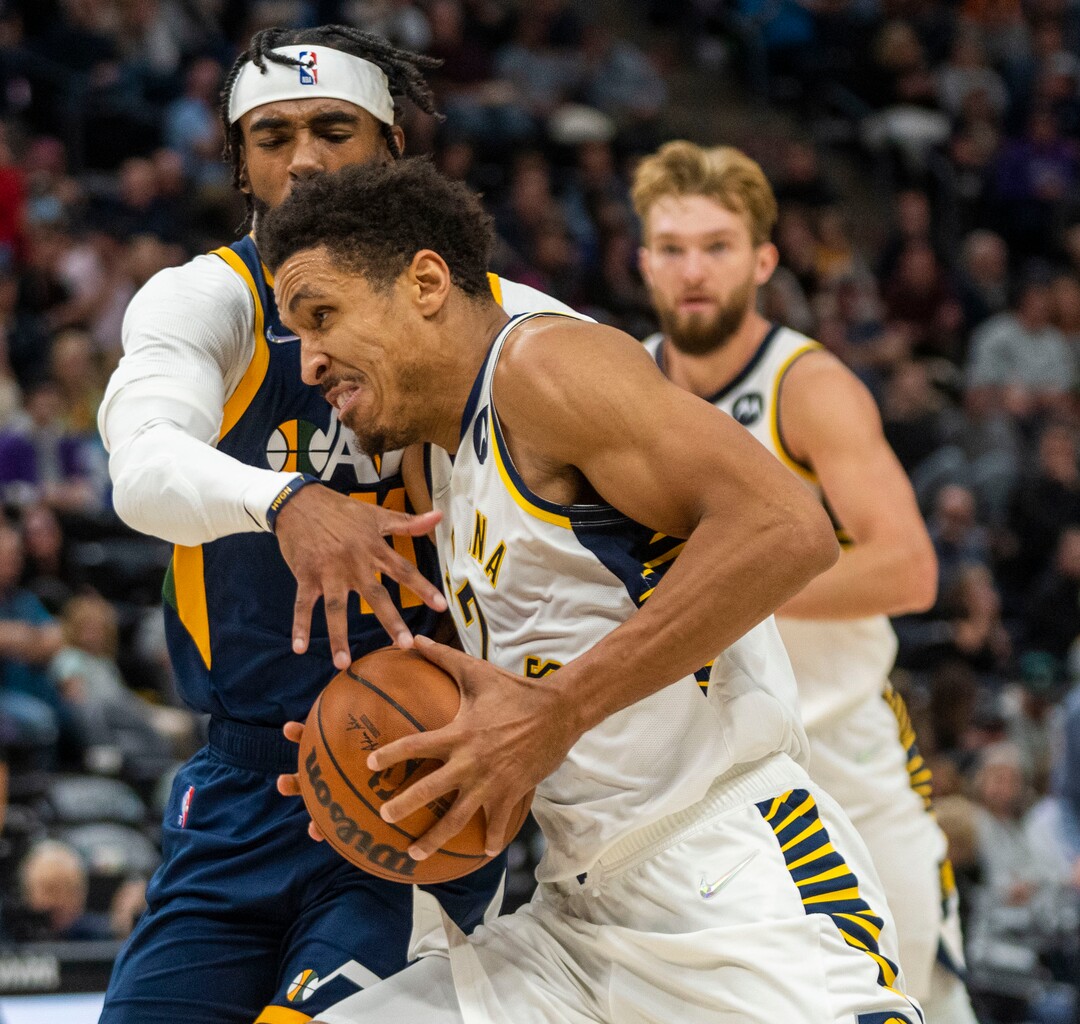 (Rick Egan | The Salt Lake Tribune) Utah Jazz guard Jordan Clarkson (00)tries to stop Indiana Pacers guard Malcolm Brogdon (7), as he takes the ball to the hoop, in NBA action between the Utah Jazz and the Indiana Pacers at Vivint Arena, on Thursday, Nov. 11, 2021.