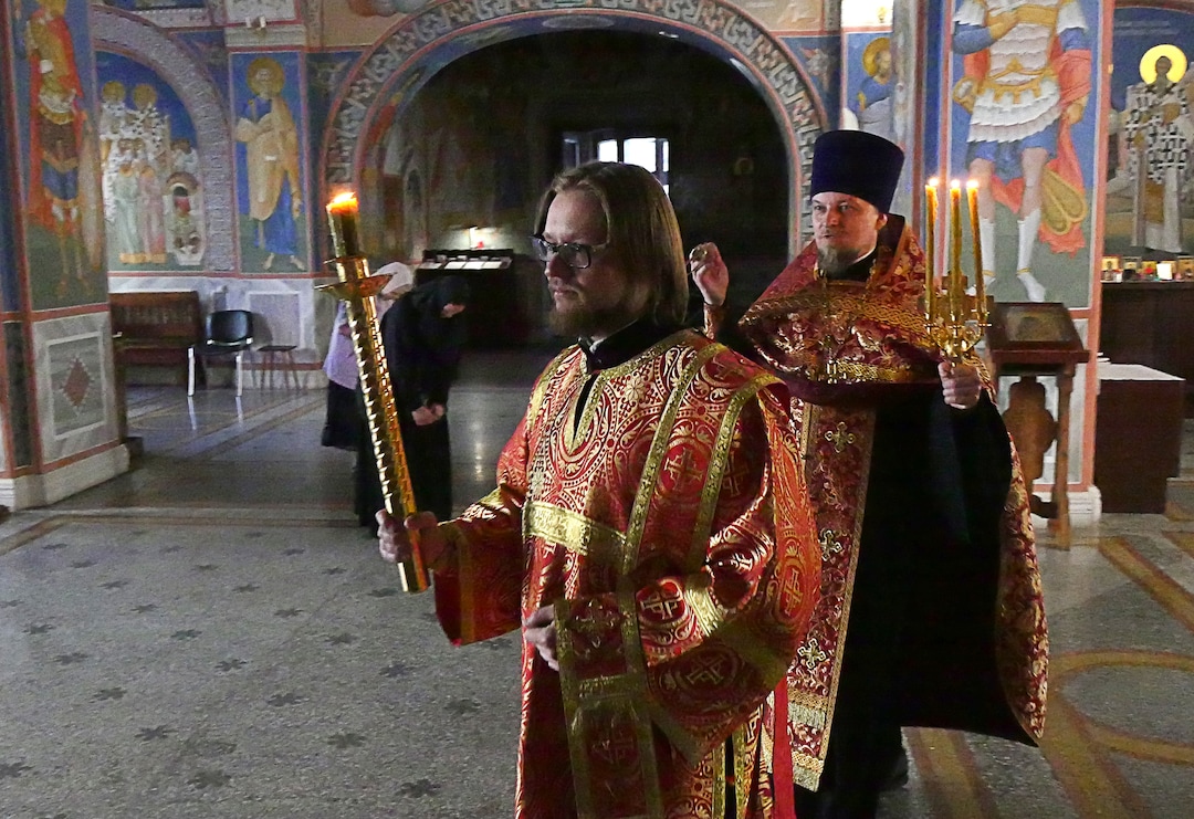 (Michael Stack  |  Special to The Salt Lake Tribune) Father Dmitry Serov, front, performs vespers with Archpriest Michael Nemnonov in Russian Orthodox Church of the Beheading of John the Baptist in Moscow.