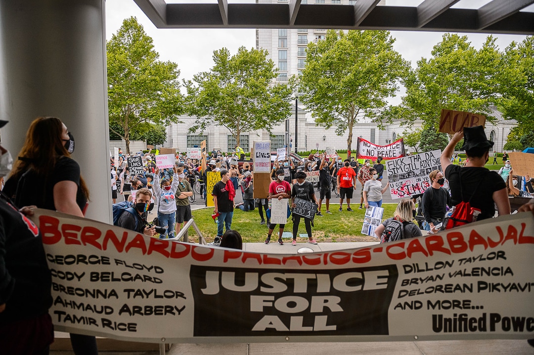 (Trent Nelson  |  The Salt Lake Tribune) People gather at the Salt Lake County District Attorney's office to protest against police brutality in Salt Lake City on Saturday, June 13, 2020.