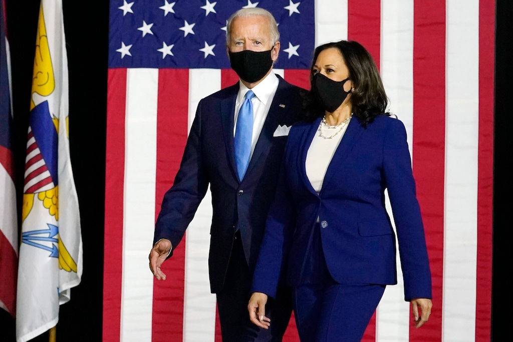 (Carolyn Kaster | AP) Democratic presidential candidate former Vice President Joe Biden and his running mate Sen. Kamala Harris, D-Calif., arrive to speak at a news conference at Alexis Dupont High School in Wilmington, Del., Wednesday, Aug. 12, 2020.