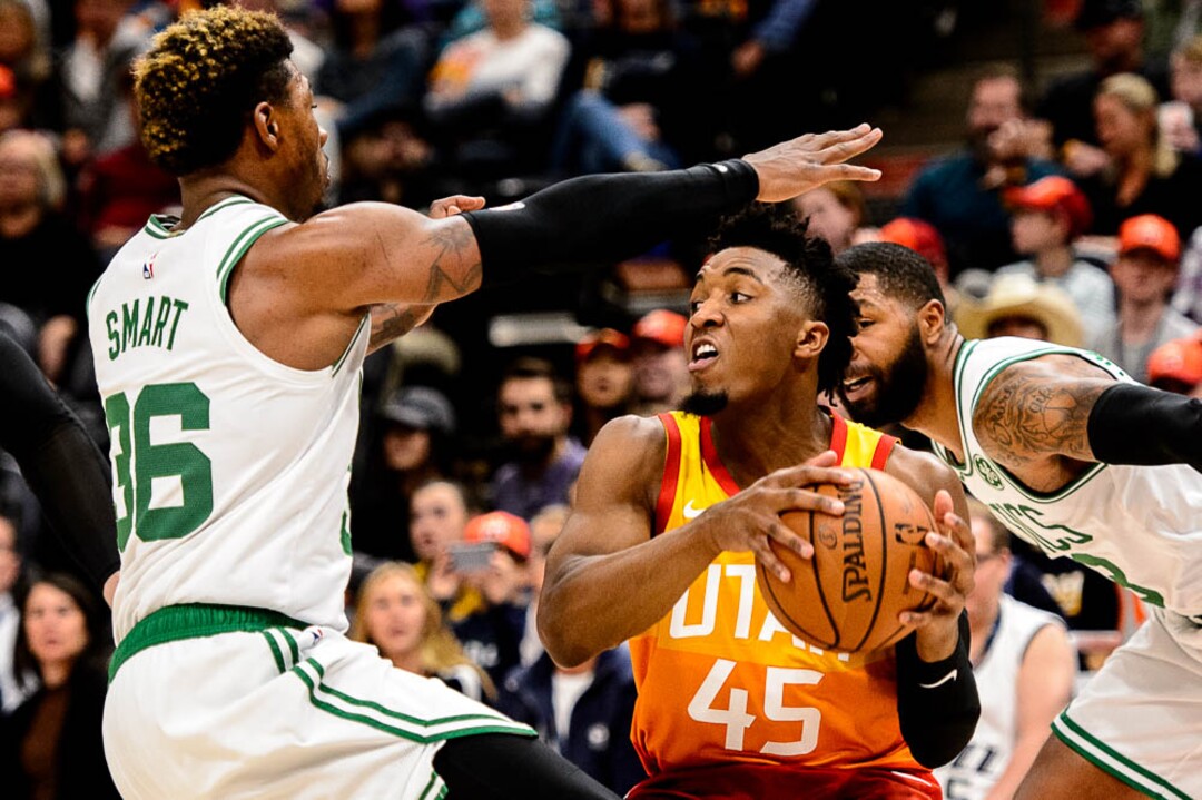 (Trent Nelson | The Salt Lake Tribune)  Utah Jazz guard Donovan Mitchell (45) defended by Boston Celtics guard Marcus Smart (36). Utah Jazz vs. Boston Celtics, NBA basketball in Salt Lake City on Friday Nov. 9, 2018.
