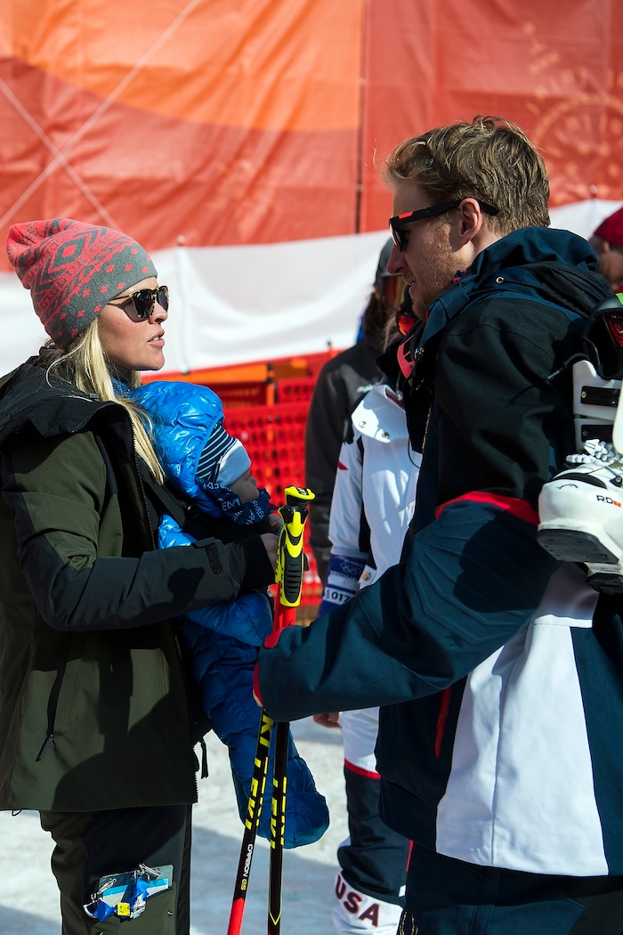 (Chris Detrick  |  The Salt Lake Tribune) Park City's Ted Ligety talks to his wife Mia Pascoe as she holds their nearly eight month-old son Jax  after competing in the Men's Giant Slalom Run 2 during the Pyeongchang 2018 Winter Olympics Sunday, Feb. 18, 2018. Ligety finished in 15th place with a combined time of 2:21.25.