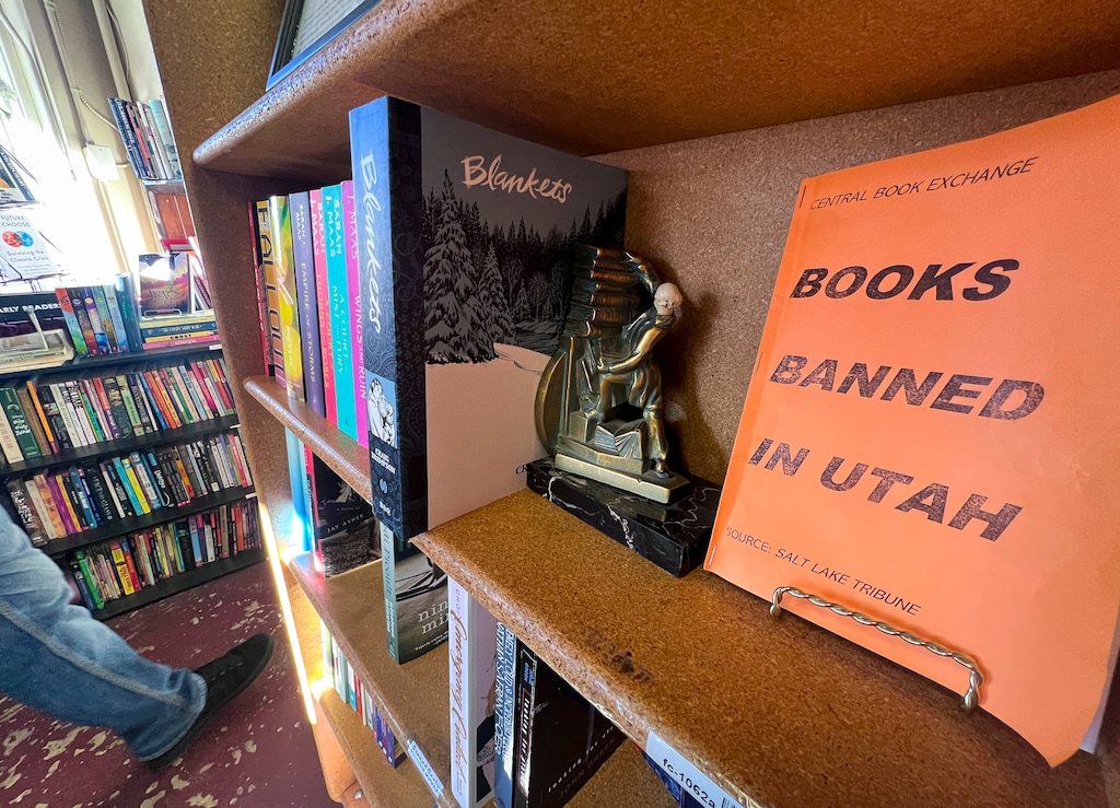 (Bethany Baker  |  The Salt Lake Tribune) A pamphlet of banned books in Utah sits on a shelf at Central Book Exchange in Salt Lake City on Saturday, Dec. 14, 2024. "Push" by Sapphire was the latest book to be banned across Utah.