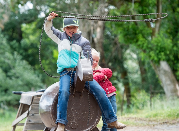 (Rick Egan  |  The Salt Lake Tribune)   at Sadie Penstra, 8, from Hooper, practices her roping skills, with her sister Paisley, 5, the 13th Annual Cowboy Legends, Music & Poetry Festival at the Historic Fielding Garr Ranch on Antelope Island, Sunday, May 27, 2018. The Festival continues through Monday.
