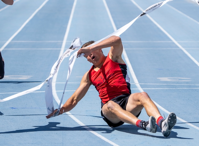 (Rick Egan | The Salt Lake Tribune)  Altamont's Ethan Hansen finishes in second place as Blake Barnes dives headfirst into the finish line for a first place finish in the 1A Boys 200 meter dash, at the State High School Championships at BYU, on Saturday, May 21, 2022.
