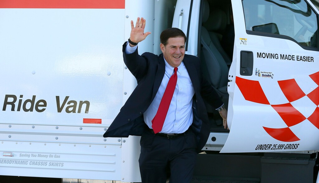 Republican Arizona Gov. Doug Ducey arrives at Arizona Capitol in a moving van prior to signing into law HB 2569 making Arizona the first state in the nation to provide universal recognition for occupational licenses Wednesday, April 10, 2019, in Phoenix. (AP Photo/Ross D. Franklin)