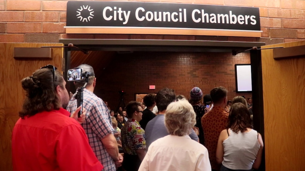 (Mori Kessler | St. George News) Members and supporters of the LGBTQ community pile into the St. George City Council chambers to voice their concerns during a City Council meeting. The Southern Utah Drag Stars group sued St. George and city leaders on Tuesday, May 23, 2023, accusing them of discrimination for denying their permit application to host an all-ages drag show at a local park.