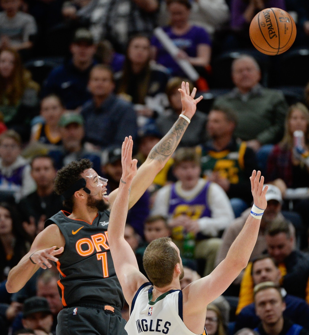 (Francisco Kjolseth  |  The Salt Lake Tribune) Orlando Magic guard Michael Carter-Williams (7) gets past Utah Jazz forward Joe Ingles (2) as the Utah Jazz host the Orlando Magic in their NBA basketball game at Vivint Smart Home Arena in Salt Lake City on Tuesday. Dec. 17, 2019.