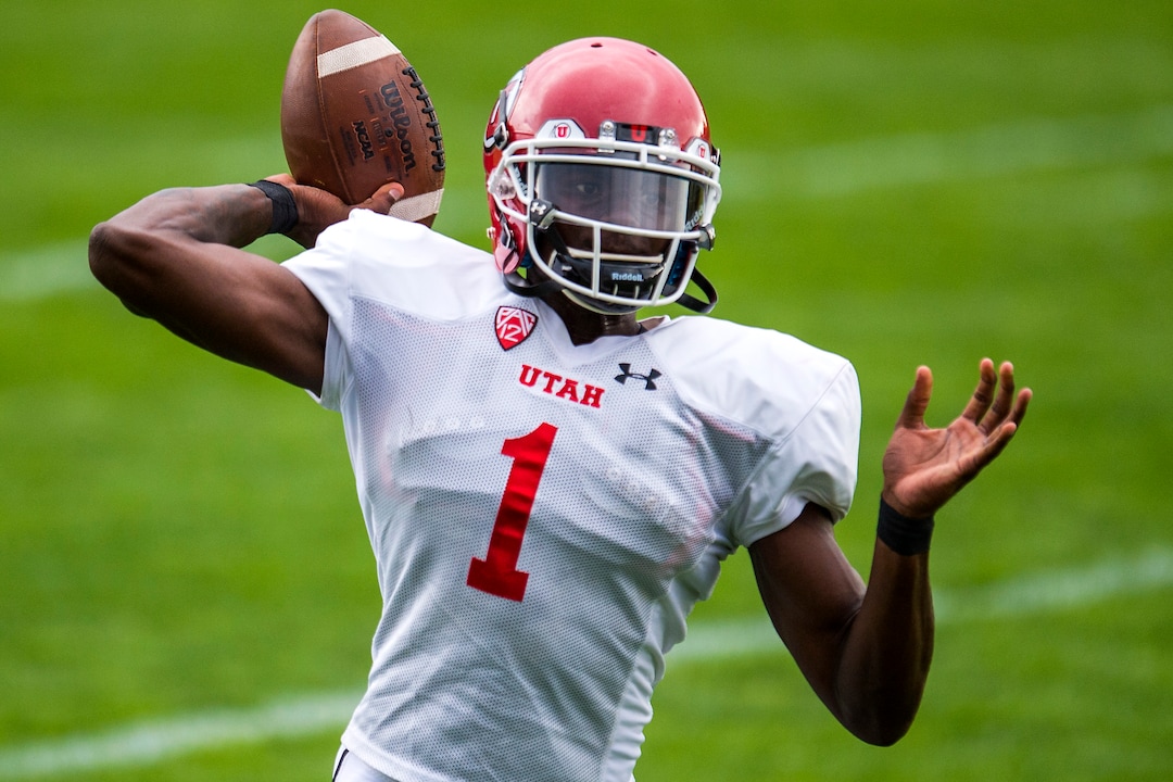 (Chris Detrick  |  The Salt Lake Tribune) Utah Utes quarterback Tyler Huntley (1) throws the ball during practice Tuesday, August 22, 2017. 