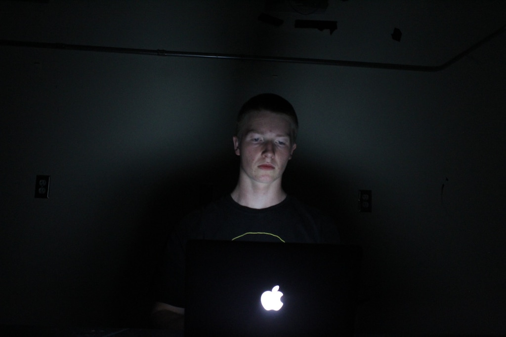 (Greg Lin | Special to The Tribune) Carter Lynch, a Highland High School senior, poses with his laptop. He was in middle school when the COVID-19 pandemic shut down schools in Utah. He said it continues to impact his education and relationships five years later.