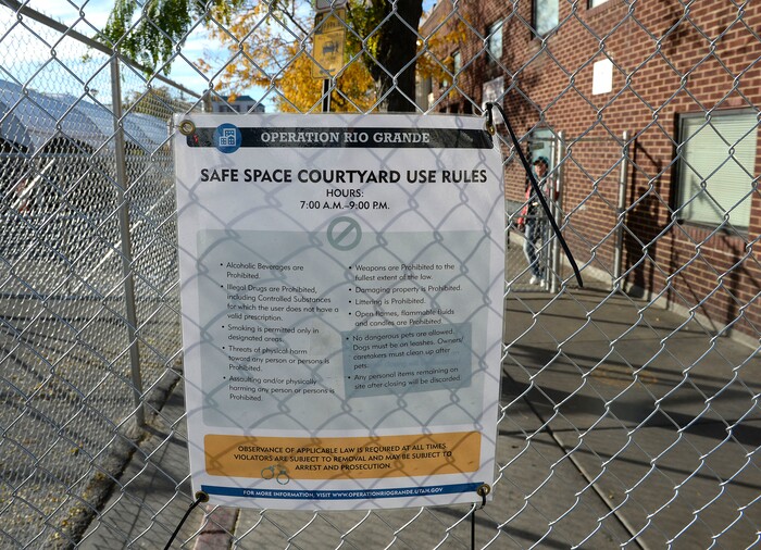 (Al Hartmann | The Salt Lake Tribune)
Rules for using safe space courtyard posted on the north side of the Road Home shelter at 200 South and Rio Grand Streets. This side of the block is locked. Starting Friday Oct. 27 officials require a homeless services ID card to access a newly created “safe space” outside the shelter accessible to people from the south on Rio Grand Street. Homeless have to have their coordinated services card scanned at a booth before passing into the "safe space" which includes a large open sided tent.