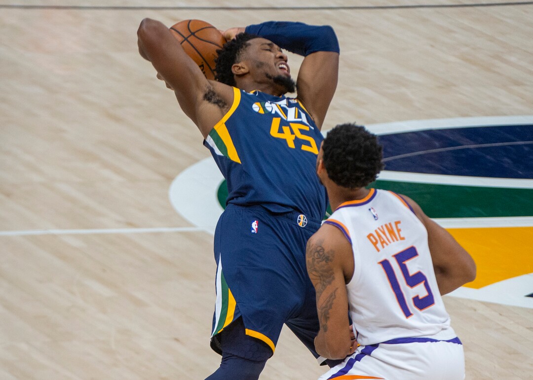 (Rick Egan | The Salt Lake Tribune) Phoenix Suns guard Cameron Payne (15) is called for a foul as he collides with Jazz guard Donovan Mitchell (45), in NBA action between the Utah Jazz and the Phoenix Suns, on Thursday, Dec. 31, 2020.