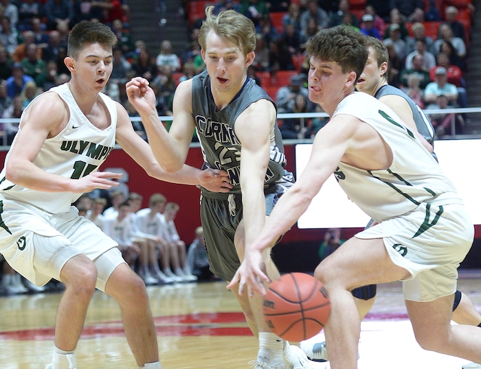 (Leah Hogsten | The Salt Lake Tribune) Corner Canyon's Blake Emery (23)tries to steal from Olympus' Jeremy DowDell (00). Olympus defeated Corner Canyon 76-49 to win the 5A High School BoysÕ Basketball Tournament Championship at the Jon M. Huntsman Center in Salt Lake City, Saturday, March 3, 2018.