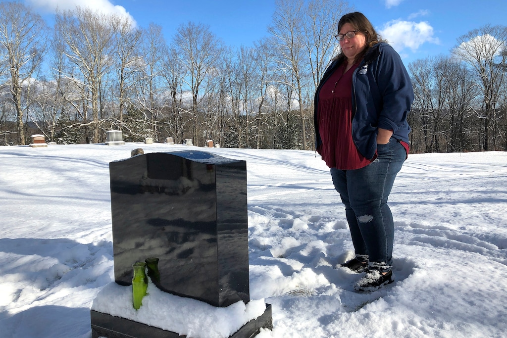 (Lisa Rathke | AP Photo) Deb Walker visits the grave of her daughter, Brooke Goodwin, Thursday, Dec. 9, 2021, in Chester, Vt. Goodwin, 23, died in March of 2021 of a fatal overdose of the powerful opioid fentanyl and xylazine, an animal tranquilizer that is making its way into the illicit drug supply. According to provisional data released by the Centers for Disease Control and Prevention on Wednesday, May 11, 2022, more than 107,000 Americans died of drug overdoses in 2021, setting another tragic record in the nation’s escalating overdose epidemic.