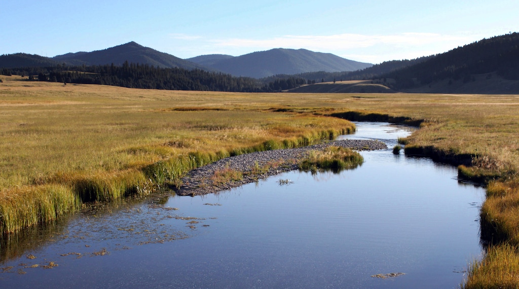 (Susan Montoya Bryan | Associated Press file photo) In this Sept. 3, 2010, file photo, the East Fork of the Jemez River cuts through Valles Caldera National Preserve, in N.M. Underground pockets of boiling water and steam that could have been tapped to produce electricity are now off limits as the Santa Fe National Forest that borders Valles Caldera National Preserve in northern New Mexico has said no to the prospect of geothermal development.