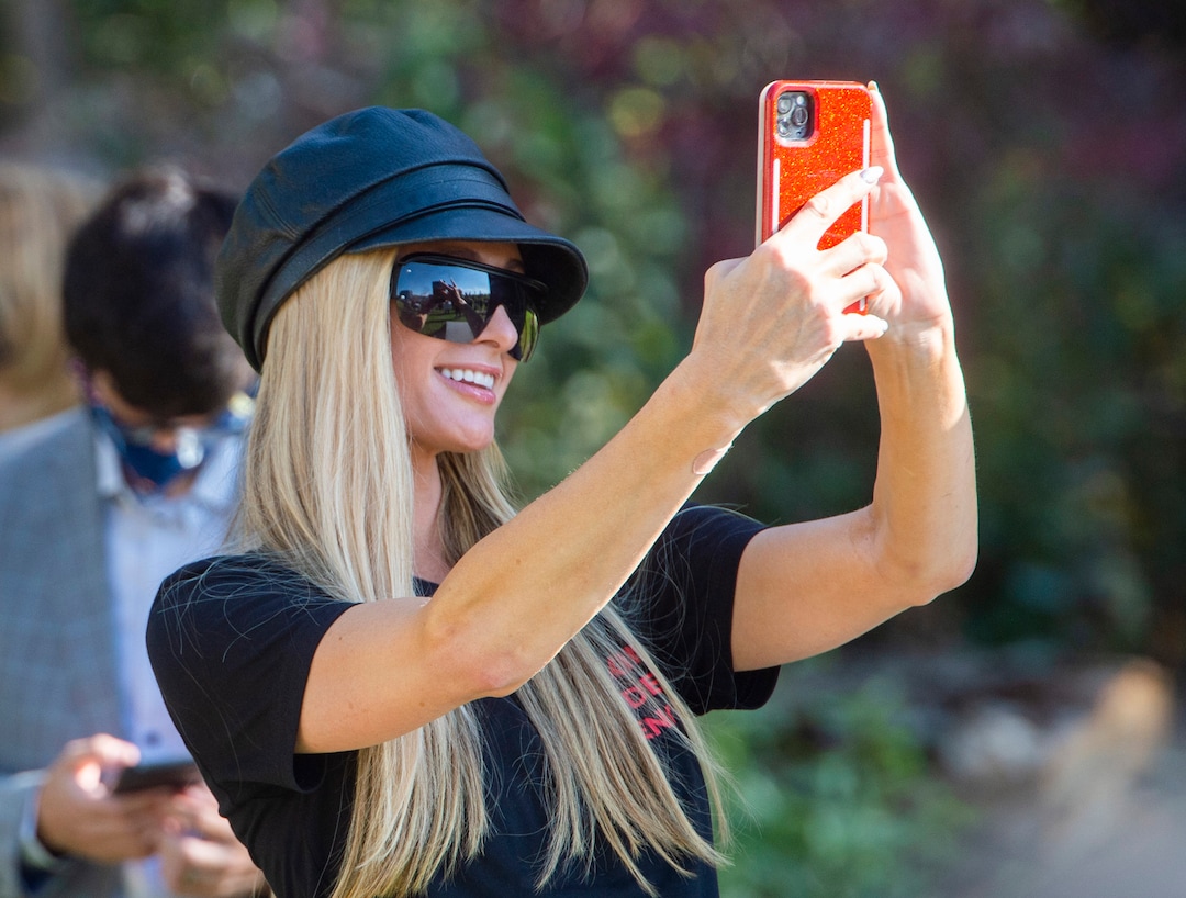 (Rick Egan  |  The Salt Lake Tribune)   Paris Hilton films the survivors during a rally calling for the closure of Provo Canyon School, a residential treatment center in Utah she attended when she was a teen, on Friday, Oct. 9, 2020.