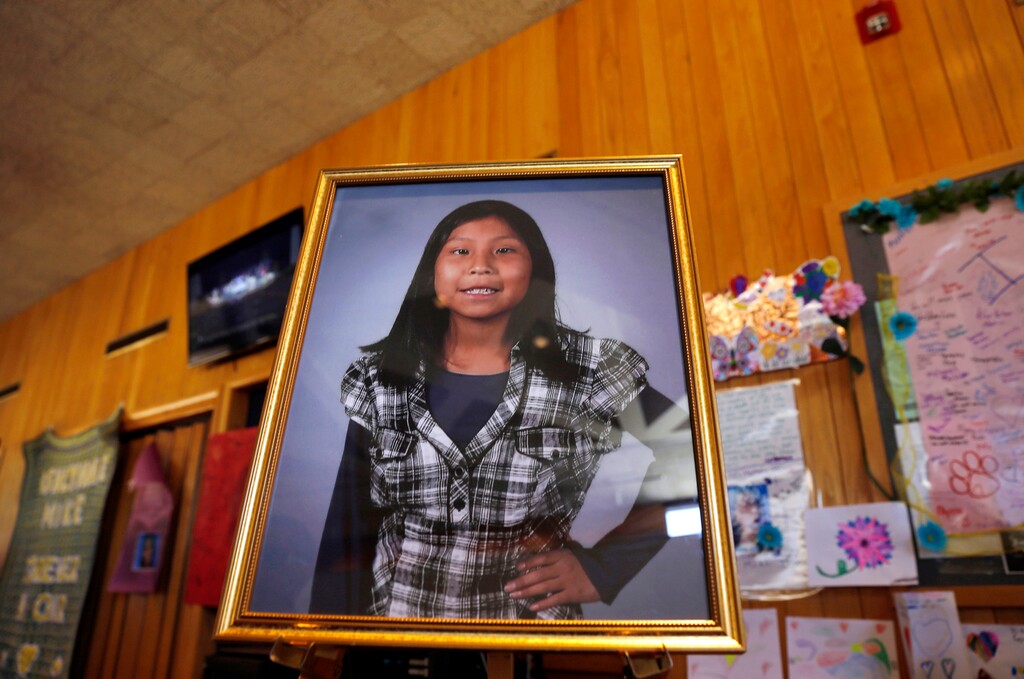 (Jon Austria/The Daily Times via AP) This May 6, 2016 photo shows a portrait of 11-year-old Ashlynne Mike on display inside the lobby of the Farmington Civic Center in Farmington, N.M. The mother of Ashlynne, a Navajo girl who was abducted and killed in 2016, is urging tribal officials to take advantage of tools and funding that have been made available for responding to reports of missing Native American children. Pamela Foster's comments Tuesday, July 30, 2019, came during a training in Albuquerque for tribes to implement the alert system. Organizers say more than 20 tribes are participating in the training.