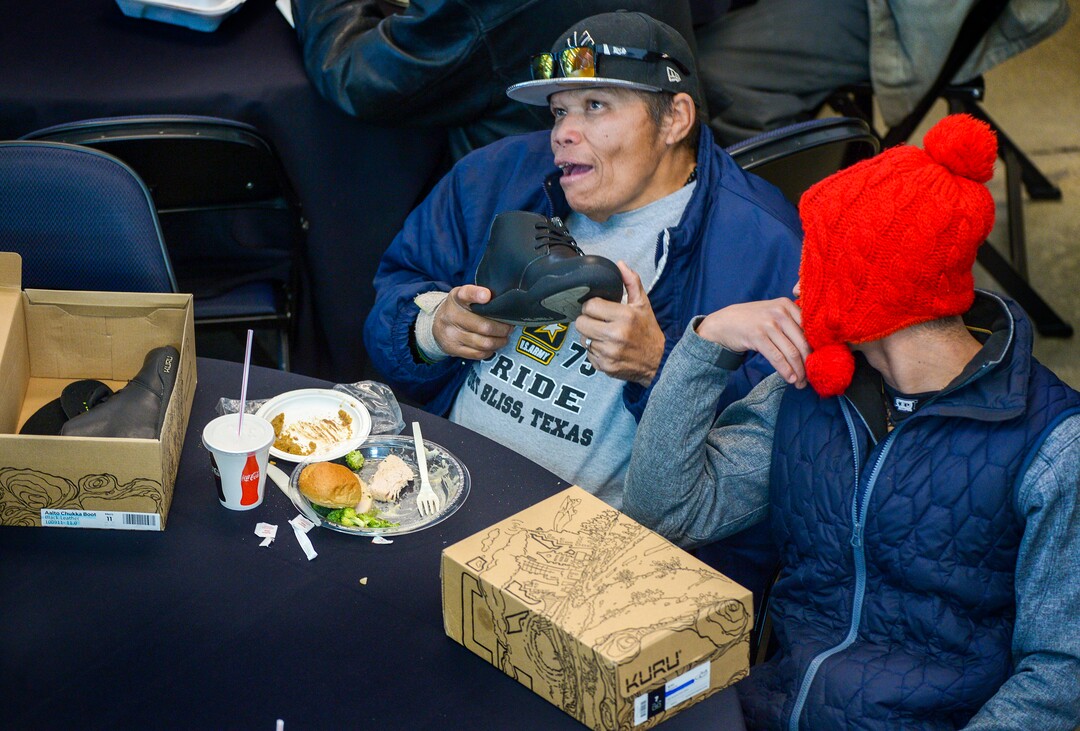 Leah Hogsten  |  The Salt Lake Tribune  l-r Luis Melendez and Angel Vega are happy to have received a new pair of shoes at the Utah Jazz and the Larry H. Miller Group sponsored annual “We Care – We Share” Thanksgiving Meal for local homeless and low-income families, Monday, Nov 19, 2018.