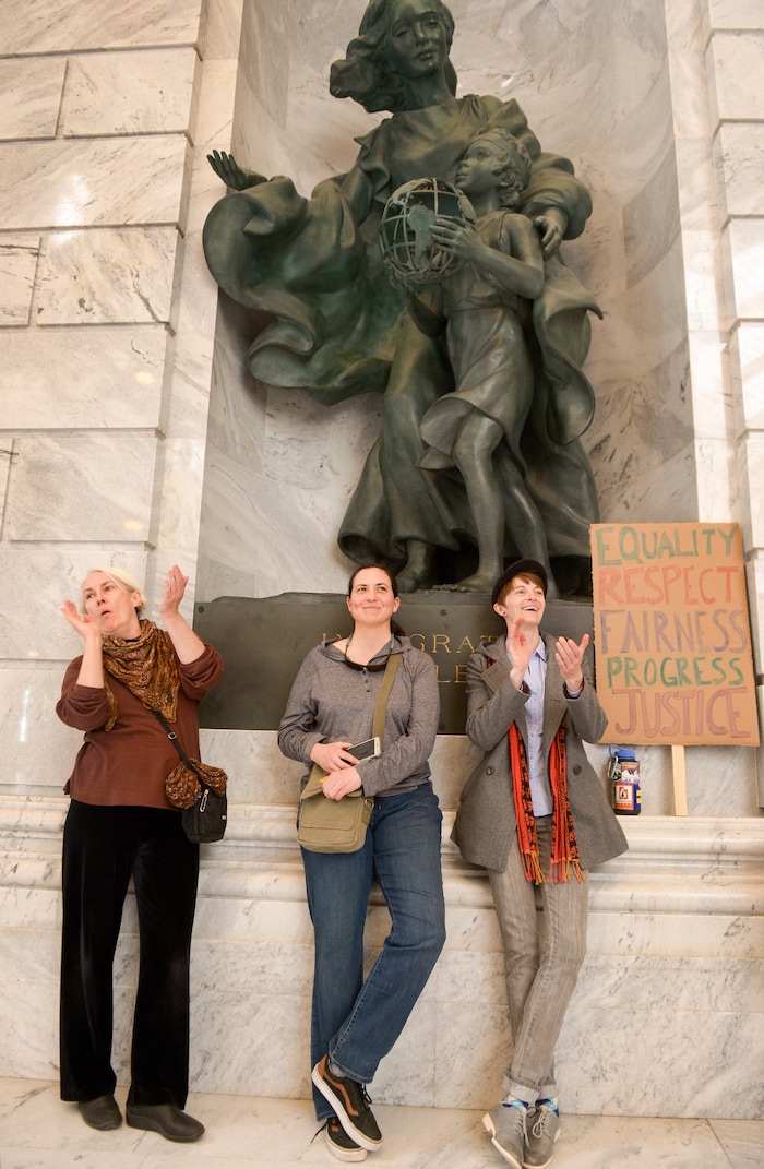 (Leah Hogsten | The Salt Lake Tribune) l-r Jenny D., Jill Jones and Addison Odum cheer and clap in agreement with speakers at Amplifying WomenÕs Voices rally to celebrate International WomenÕs Day at the Utah State Capitol Rotunda, hosted by KRCL Thursday, March 8, 2018.