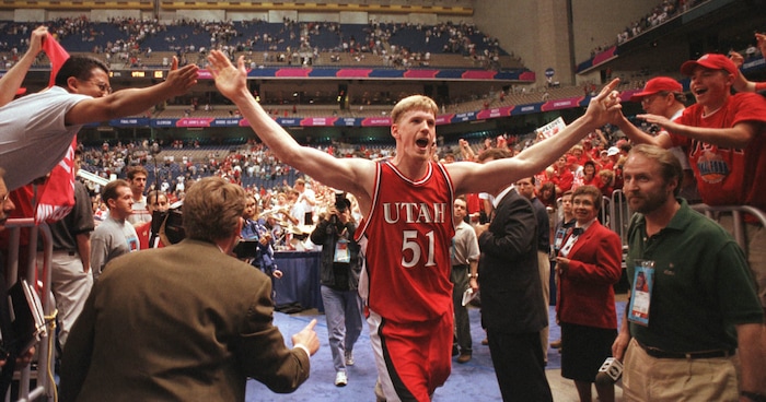 (Steve Griffin  |  Tribune file photo)  Utah's Michael Doleac celebrates with fans after their victory over North Carolina in the 1998 Final Four at the Alamodome in San Antonio, Texas.