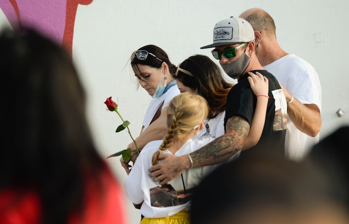 (Francisco Kjolseth  |  The Salt Lake Tribune) Family of Zane James, who was killed by Cottonwood Heights police in 2018, join a vigil organized on the six-year anniversary of Dillon Taylor’s death by the murals of those people killed by police near 800 South and 300 West in Salt Lake City on Tuesday, August 11, 2020. Multiple families who’s loved one’s are depicted on the walls joined the vigil as they moved from portrait to portrait to remember them.