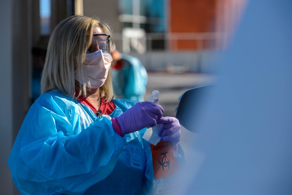 (Trent Nelson  |  The Salt Lake Tribune) Jennie McQueen working at a COVID-19 testing station at Rice-Eccles Stadium in Salt Lake City on Monday, Oct. 12, 2020.