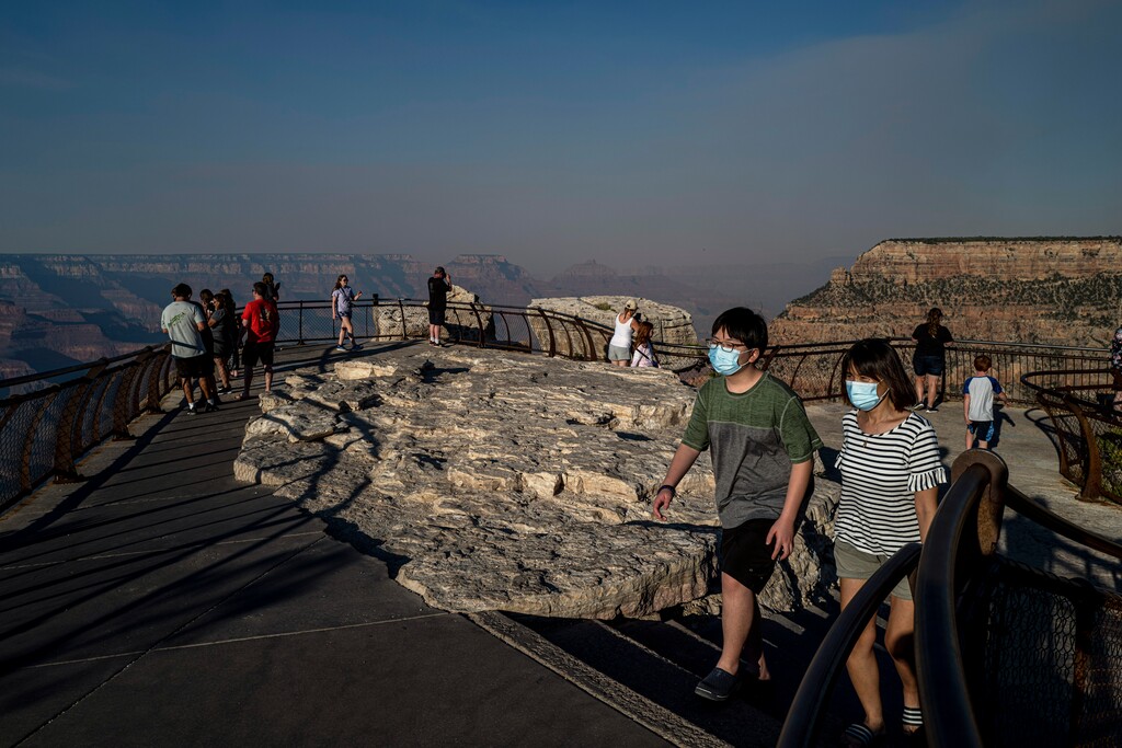 (Adriana Zehbrauskas | The New York Times) Visitors to Grand Canyon National Park in Arizona on July 8, 2020. National parks - sometimes many miles from equipped hospitals - are grappling with how to safely stay open.
