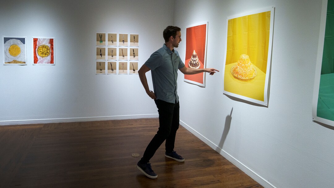 (Leah Hogsten | The Salt Lake Tribune)  Daniel George discusses his photograph Primary #1 (Cinnamon Jello Salad), Archival Pigment Prints, 2020, from "Marrow,"  George's photo exhibit at The Utah Museum of Contemporary Art, Sept. 3 2021. George examines the culinary and cultural heritage of members of The Church of Jesus Christ of Latter-day Saints. George recreated and photographed dishes from Ward Cookbooks, including Funeral Potatoes, Casseroles, Jello creations, turning food into folk art.