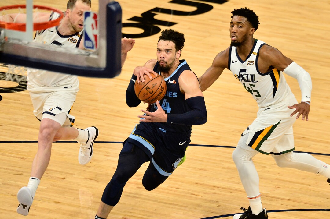 (Brandon Dill | The Associated Press) Memphis Grizzlies forward Dillon Brooks (24) drives between Utah Jazz guards Donovan Mitchell (45) and Joe Ingles in the first half of Game 4 of an NBA basketball first-round playoff series Monday, May 31, 2021, in Memphis, Tenn.