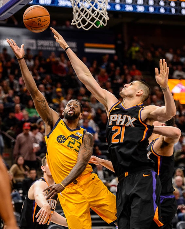 (Trent Nelson | The Salt Lake Tribune)  Utah Jazz forward Royce O'Neale (23) shoots over Phoenix Suns center Alex Len (21)  as the Utah Jazz host the Phoenix Suns, NBA basketball in Salt Lake City, Wednesday Feb. 14, 2018.