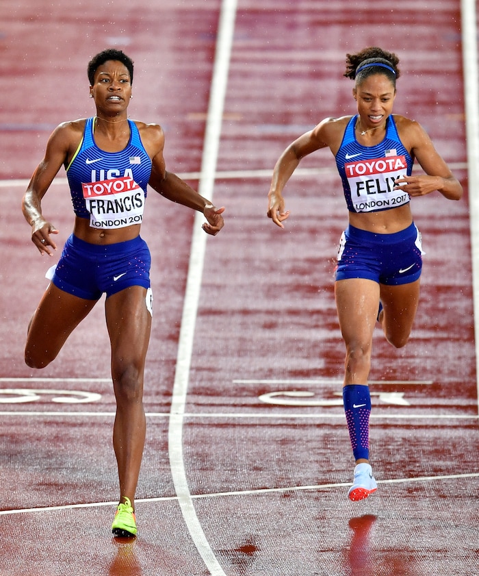 United States' Phyllis Francis, left, crosses the finish line to win the Women's 400 meters final ahead of compatriot and bronze medalist United States' Allyson Felix at the World Athletics Championships in London Wednesday, Aug. 9, 2017. (AP Photo/Martin Meissner)